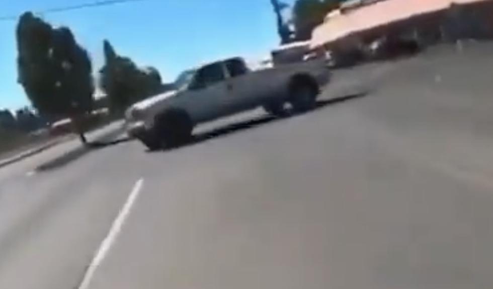 Motorcyclist Slides Under Truck, Gets Up and Walks Away From Accident [VIDEO]