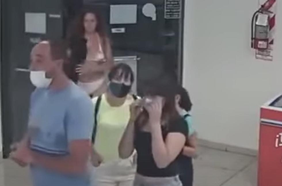 Woman Takes Dress Off to Use As Mask While Family Looks On [NSFW-VIDEO]