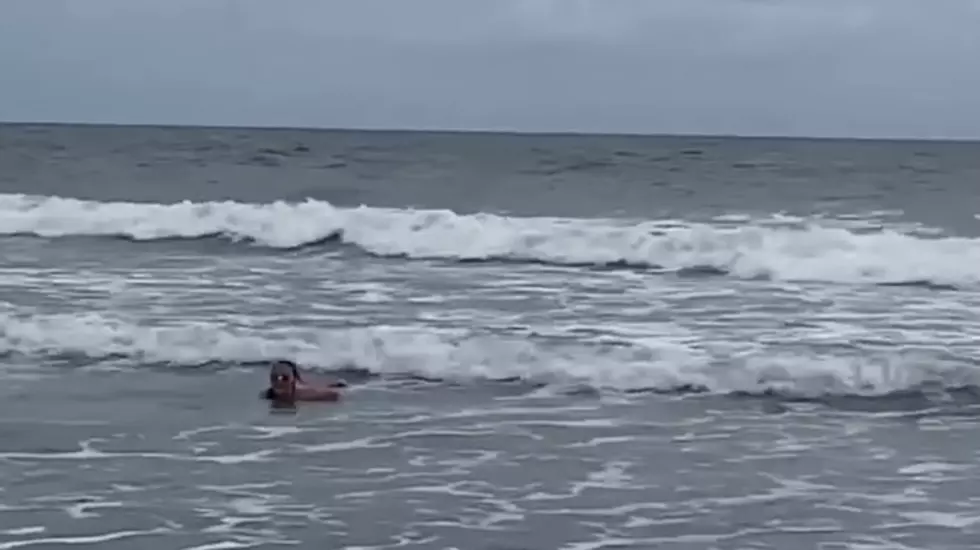 Watch: Girl, 11, frightened from surf by approaching shark