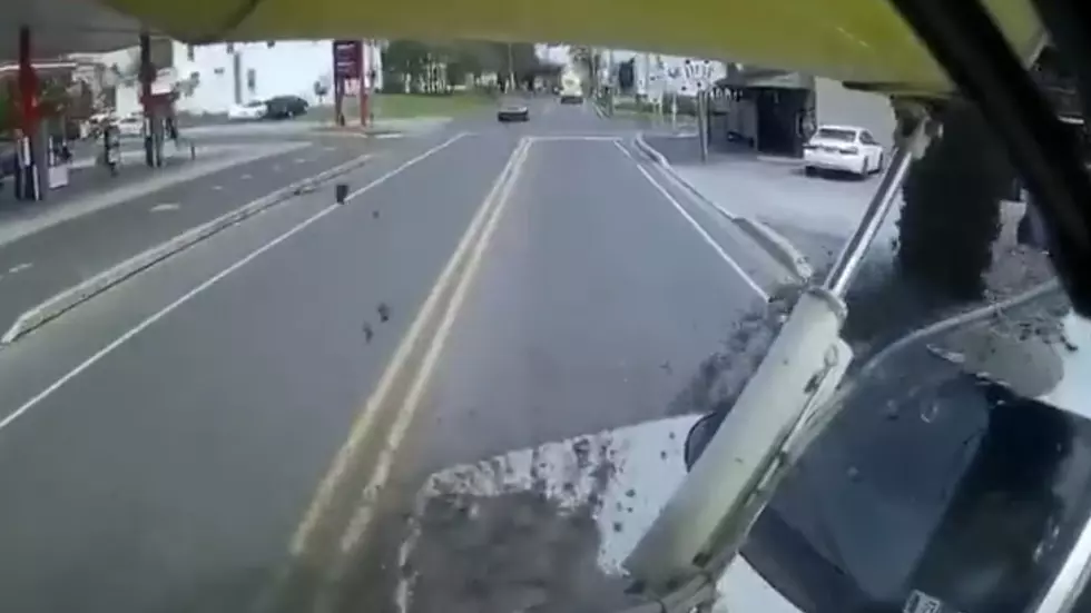 Unsuspecting Driver Pulls Out in Front of Cement Truck