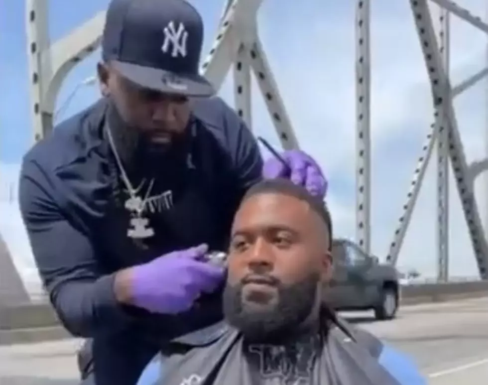 Man Getting Haircut on Mississippi River Bridge Sparks Outrage on Social Media