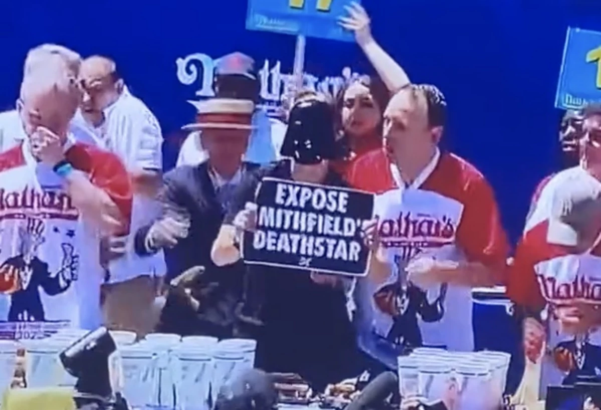 Joey Chestnut Chokes Out Protester During Hot Dog Eating Contest