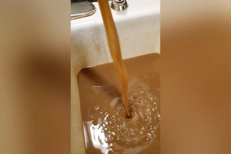Brown Water Seen Pouring Out of Faucets in Sunset