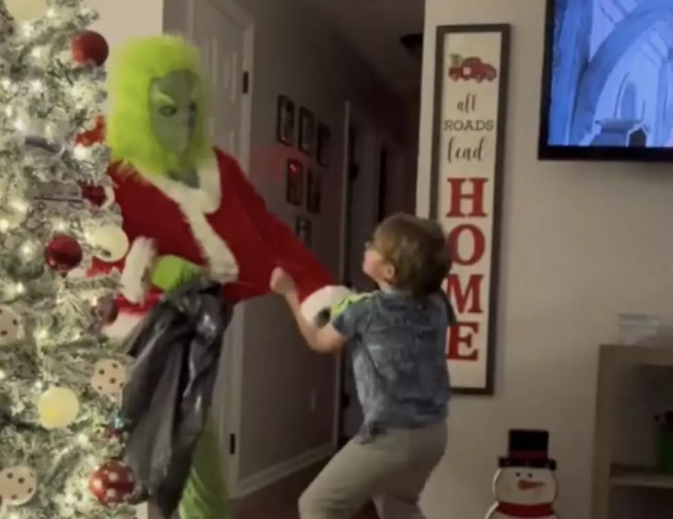 Kid Aggressively Fights Off ‘Christmas Grinch’ As He Steals Presents [WATCH]