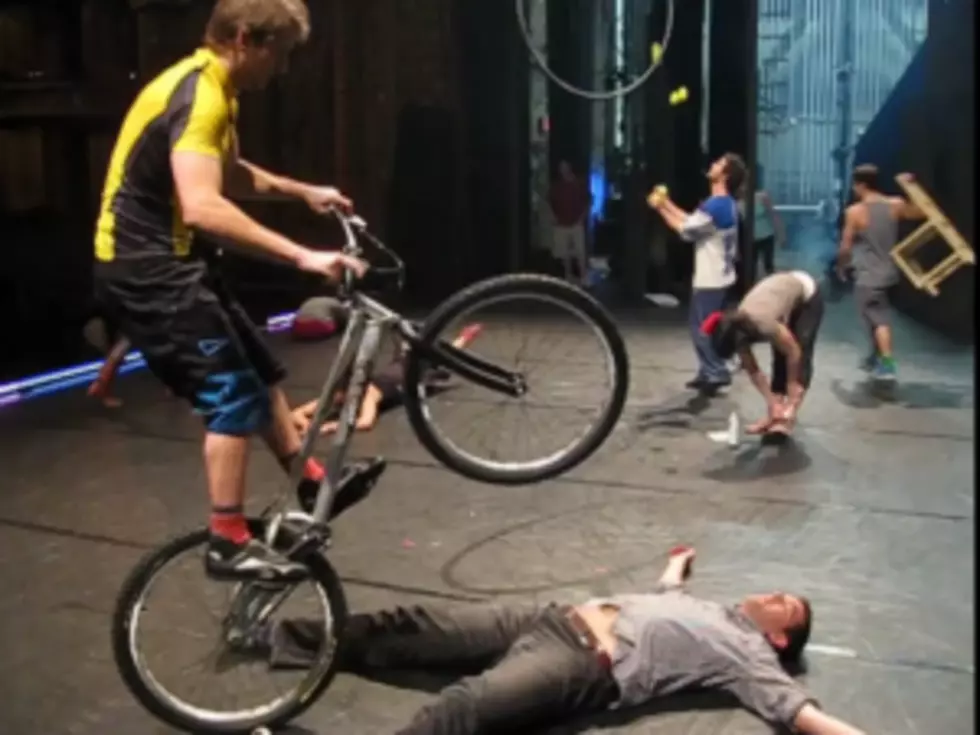 Performer Jumps Bike Over Person in Dangerous-Looking Stunt [VIDEO]