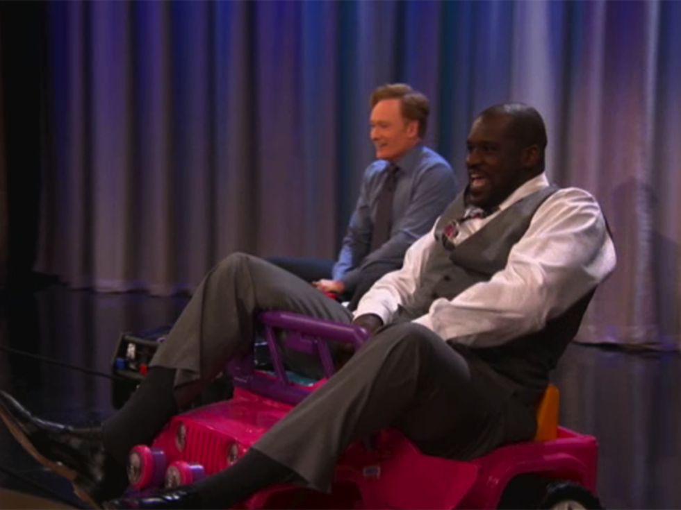Shaquille O’Neal Falls Off a Tiny Pink Toy Jeep on ‘Conan’ [VIDEO]