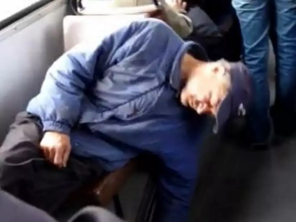 Watch a Sleeping Man Tumble Into the Bus Aisle