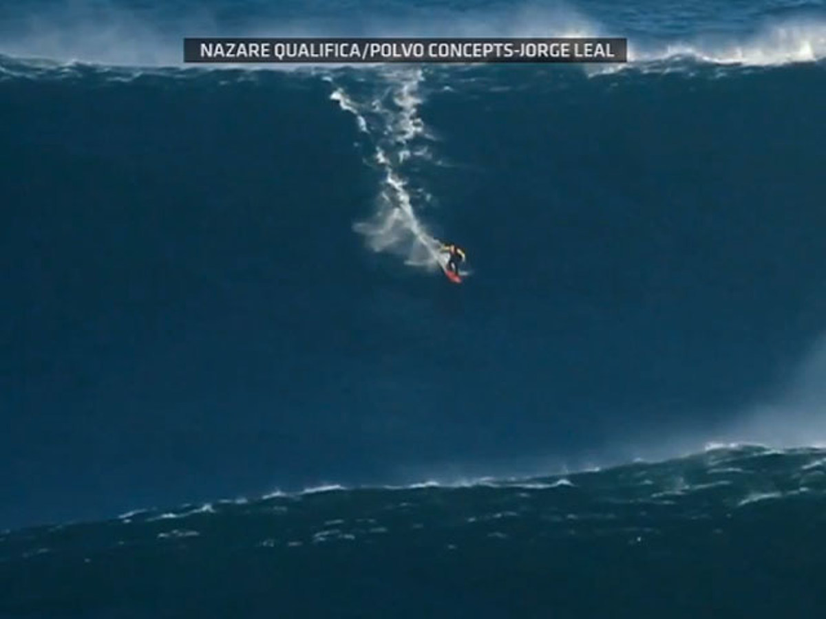 See through landlady Booth Garrett McNamara Surfs Record Breaking 90-Foot Wave [VIDEO]