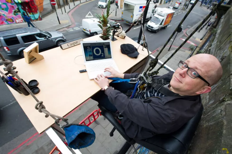 Company Proves You Can Work From Anywhere… Even While Dangling From a Building