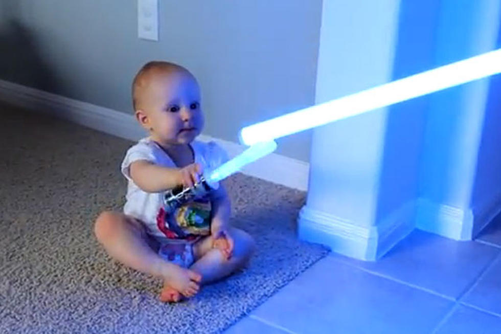 Jedi Baby Duels Dad With Lightsaber