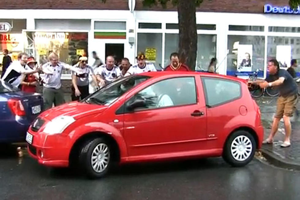 Woman Attempting to Park Car Celebrated by Drunk German Fans