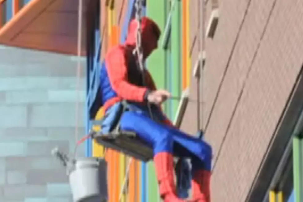 Superheroes Wash Windows at Children's Hospital