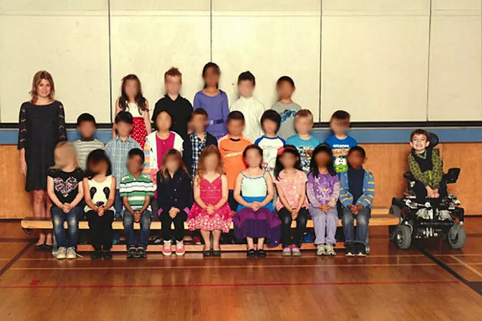 Disabled Second Grader Kept Apart from Fellow Students in Class Photo