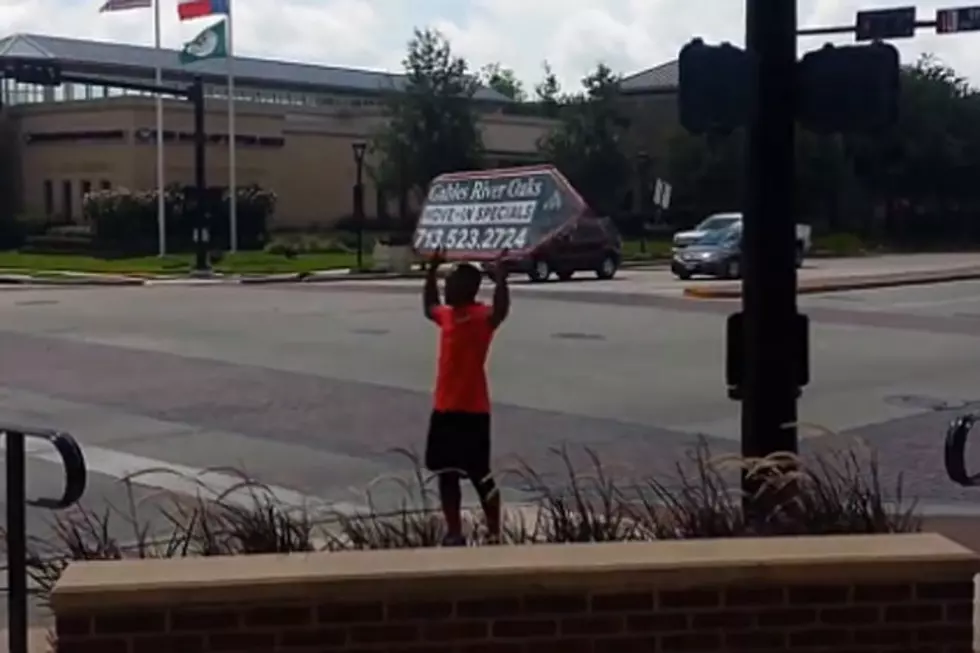 Who Knew Holding a Sign Could Be So Entertaining?