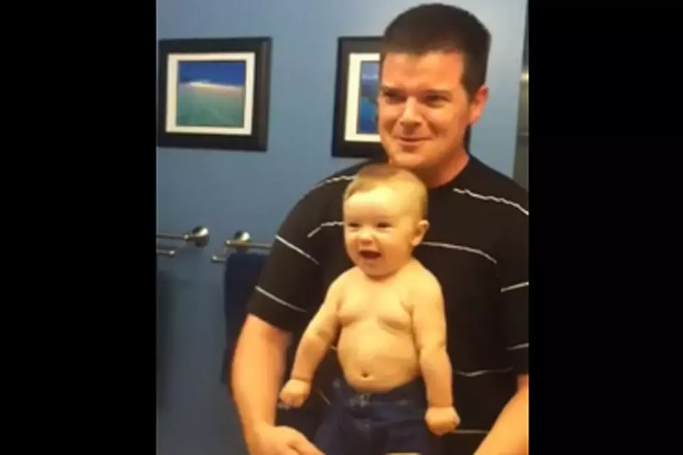 Dad and Adorable 8-Month-Old Son Flex Muscles 