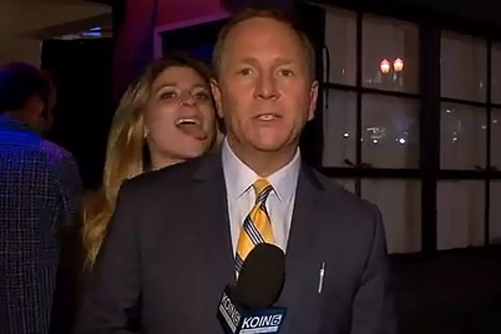 Why Is This Woman Licking a Reporter?