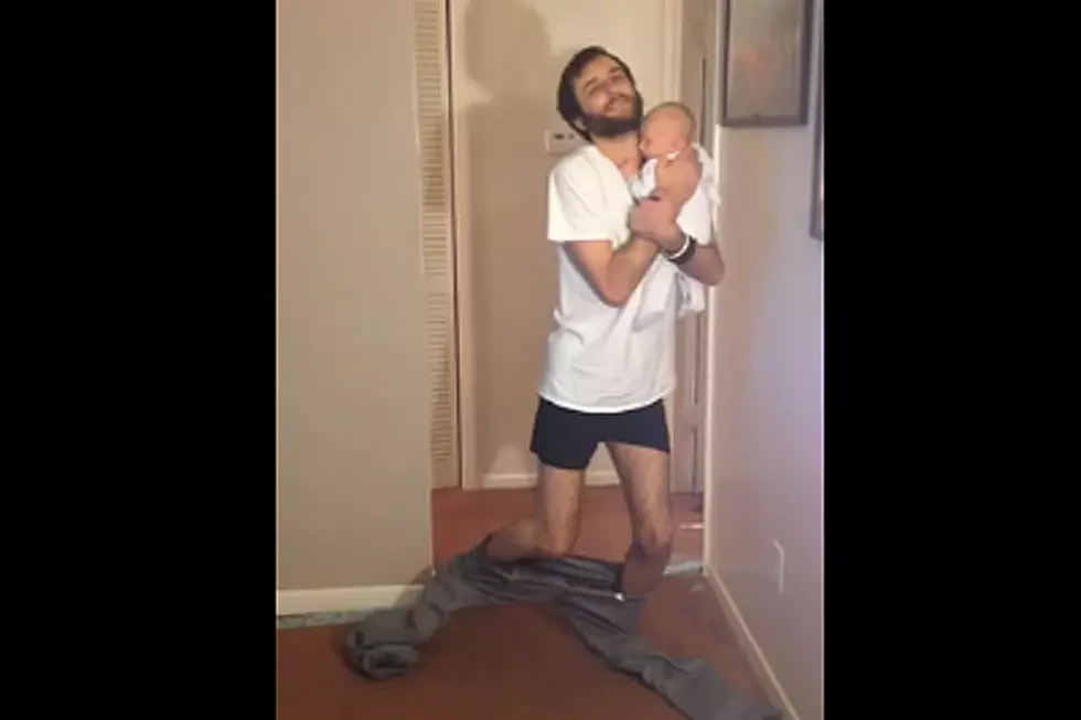 Dad Holding Baby Doesn’t Need Hands to Put On Pants