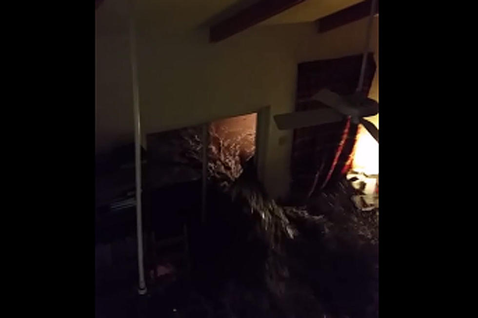 Watch Footage of Out-of-Control River Flooding Into Home