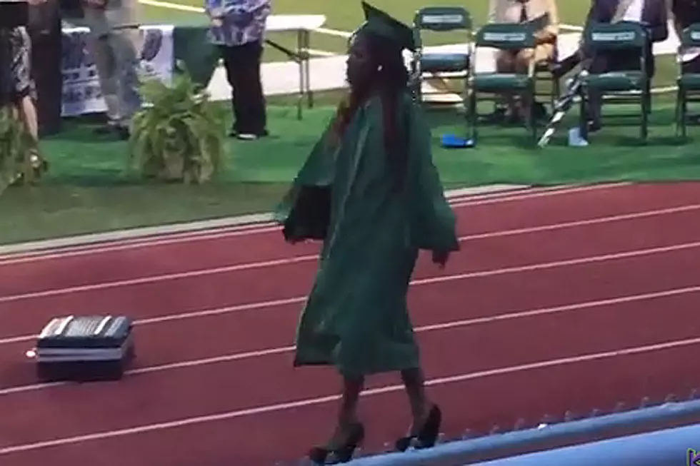 High School Graduate Takes Hilarious Fall in High Heels