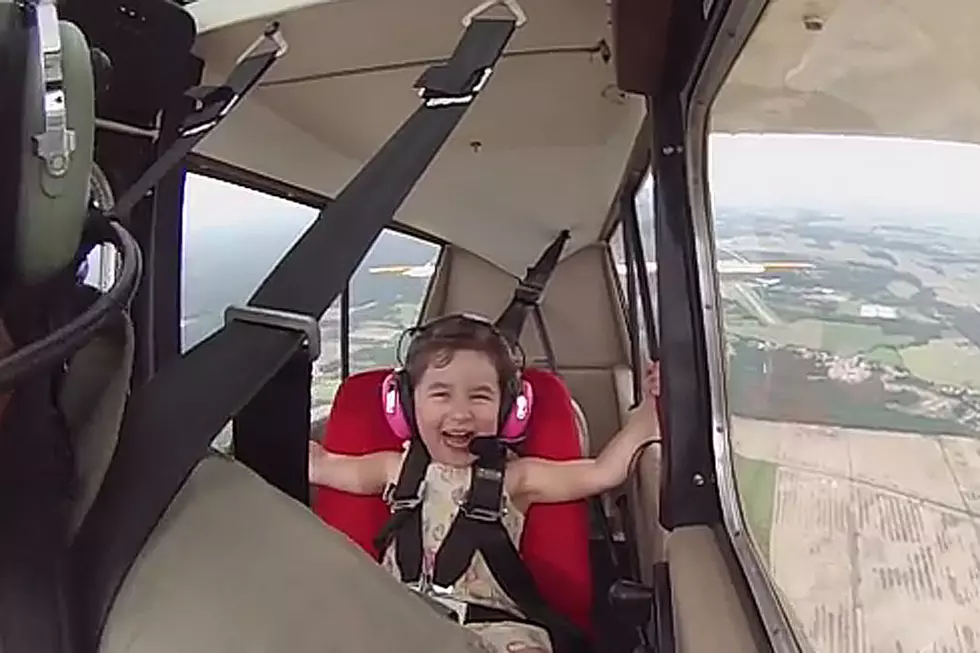 Little Girl With Wonderful Laugh Can’t Get Enough of Airplane Ride