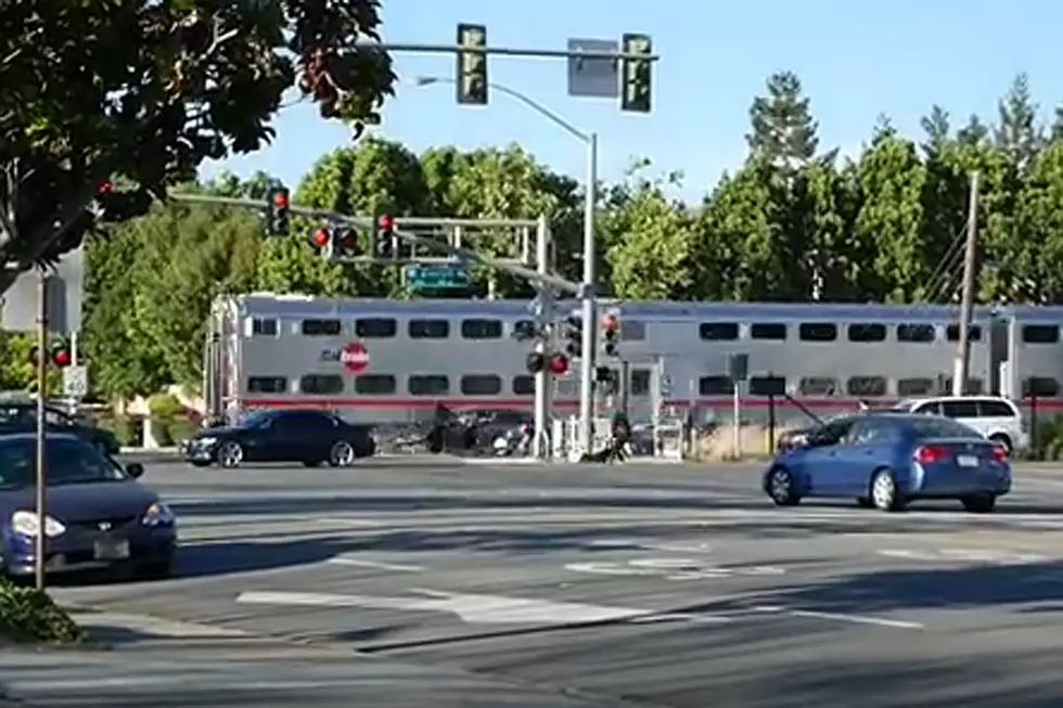 Watch Chilling Video of Man Pulled From Car Seconds Before Train Hits