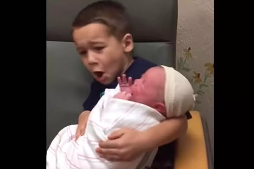 Baby Scares Heck Out of Big Brother Holding Him for 1st Time