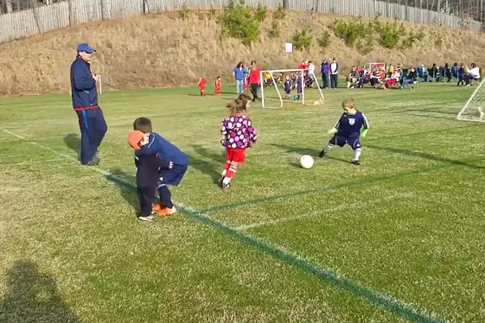Little Boy Stops Playing Soccer Mid-Match to Hug Younger Brother