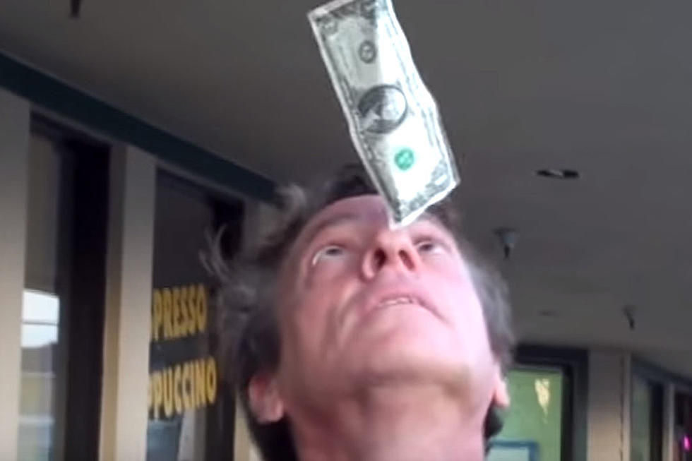 Get a Load of the World’s Premiere Dollar Bill Nose Balancer