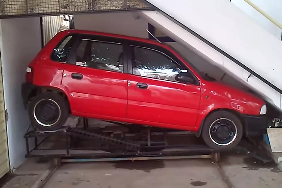 Man Finds Perfectly Perfect Way to Park Car Under Stairway