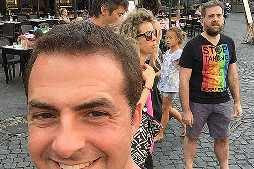 Man in ‘Stop Taking Selfies’ Shirt Ticked to Be in a Selfie