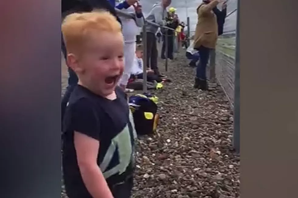 Little Boy Watching Motorcycle Race Is What Pure, Unadulterated Joy Looks Like