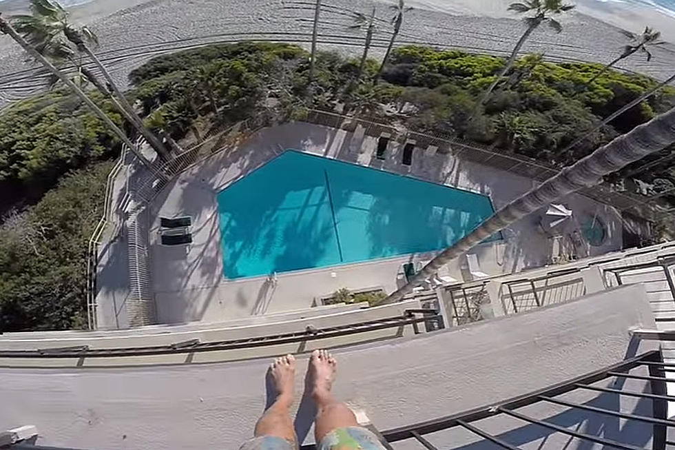 Maniac Somehow Successfully Jumps Off High Balcony Into Hotel Pool
