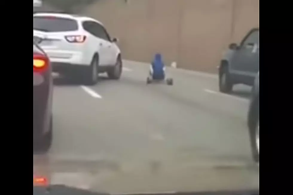 Man on Big Wheel Goes for Inexplicable Spin on the Highway