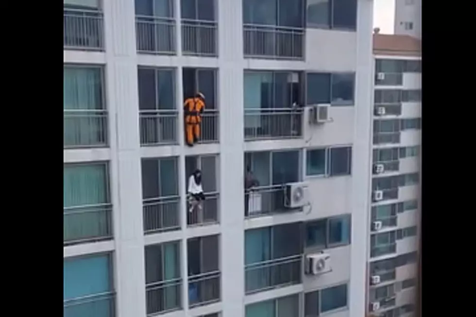 Watch Brave Firefighter Save Suicidal Woman on Balcony