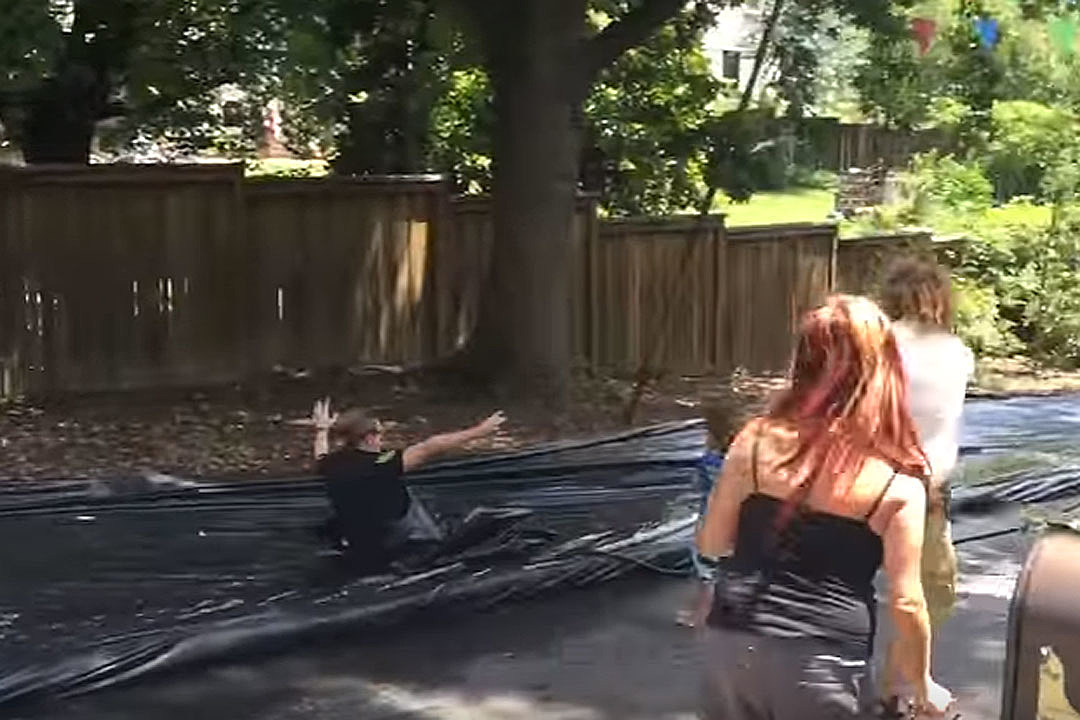 Police Responding to Complaint Join In Slip 'N Slide Fun