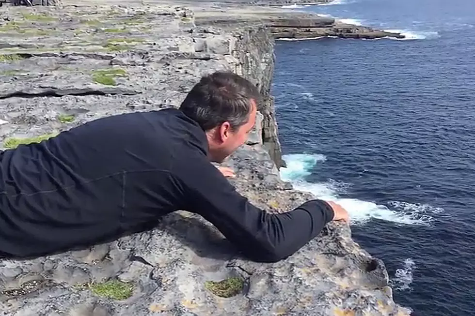 Dad With Debilitating Fear of Heights Takes In Astonishing View Over a Cliff