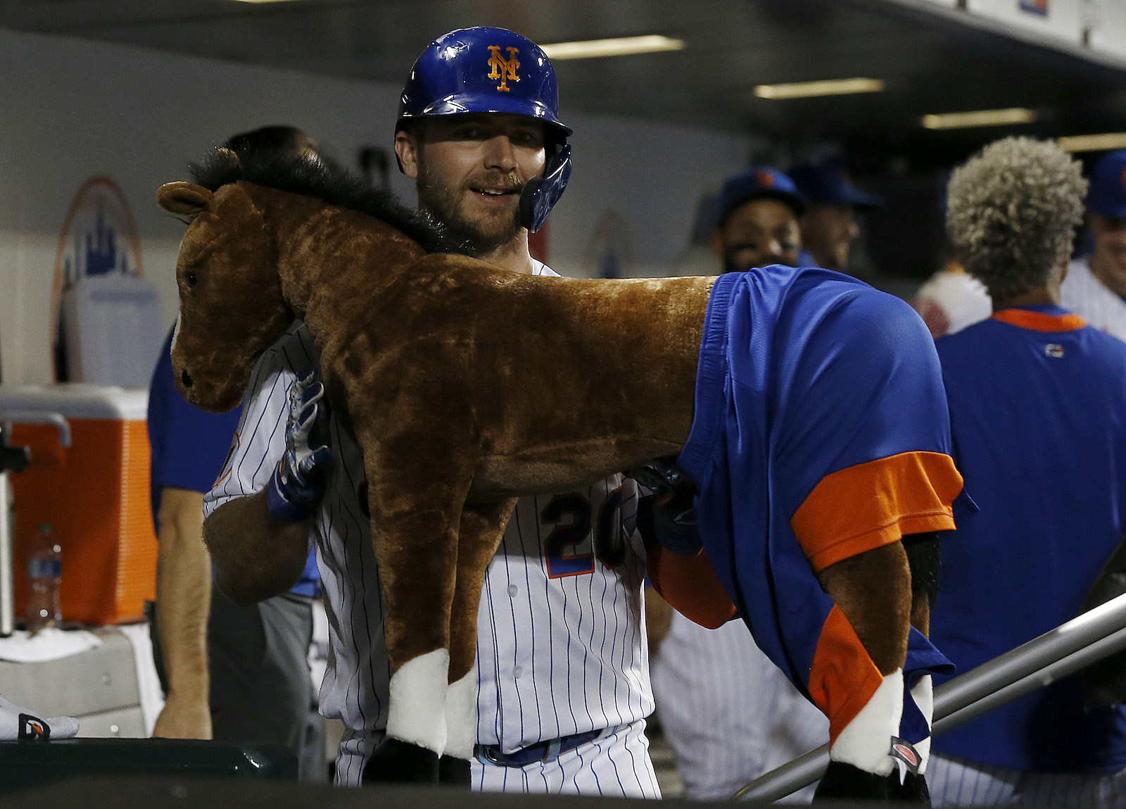 Jonny Deluca of the Los Angeles Dodgers is greeted in the dugout News  Photo - Getty Images