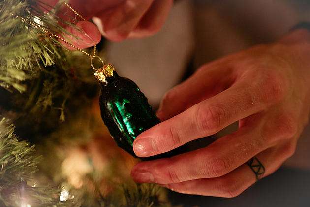 Hanging a Unique Ornament on the Christmas Tree