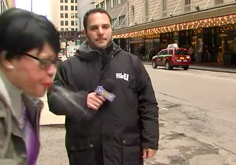 Crazy Spitting Woman Interrupts News Reporter [Video]