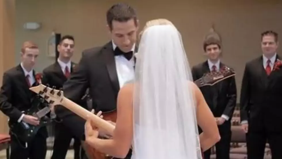 Newlywed Couple Play Guitar And Shred During Wedding Procession [Video]