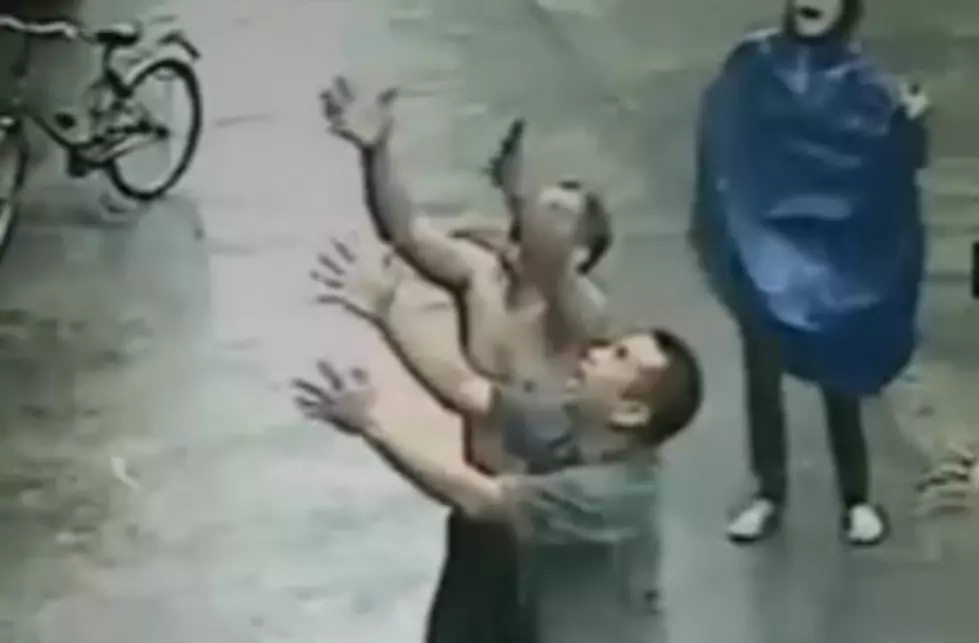 Chilling Footage Of A Man Catching A Baby Falling From A Two Story Window [Video]