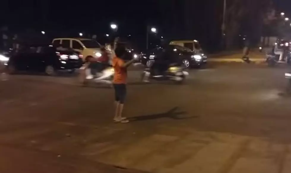 Little Kid Perfectly Directs Traffic In The Middle Of A Jam [Watch]