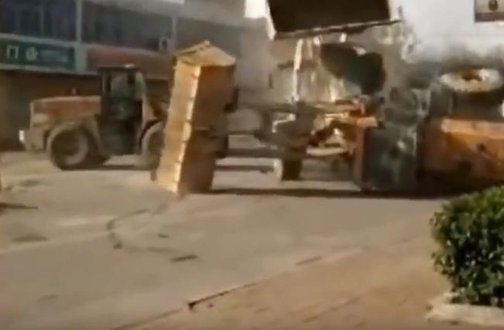 Bulldozers Do Vicious Battle In The Street [Video]