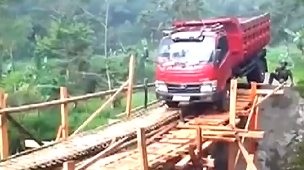 Truck Tries To Cross Horribly Weak Bridge in Asia [VIDEO]