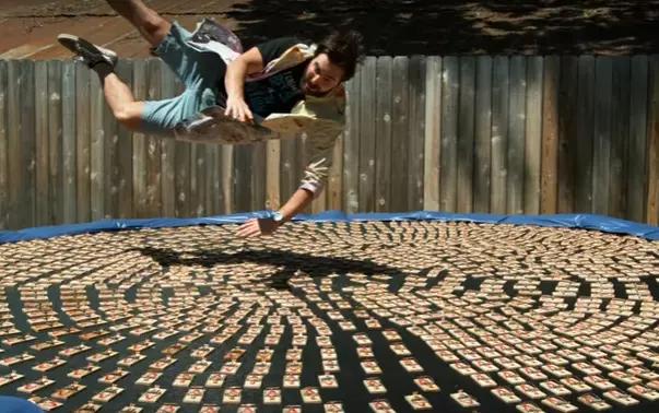 Slow Mo Jumping On Trampoline With 1,000 Mouse Traps [Video]