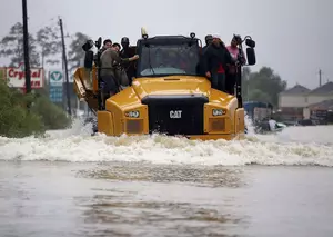 TX Residents Rescued From Flood Waters By Dump Truck