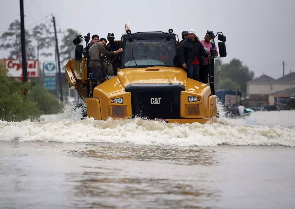 TX Residents Rescued From Flood Waters By Dump Truck