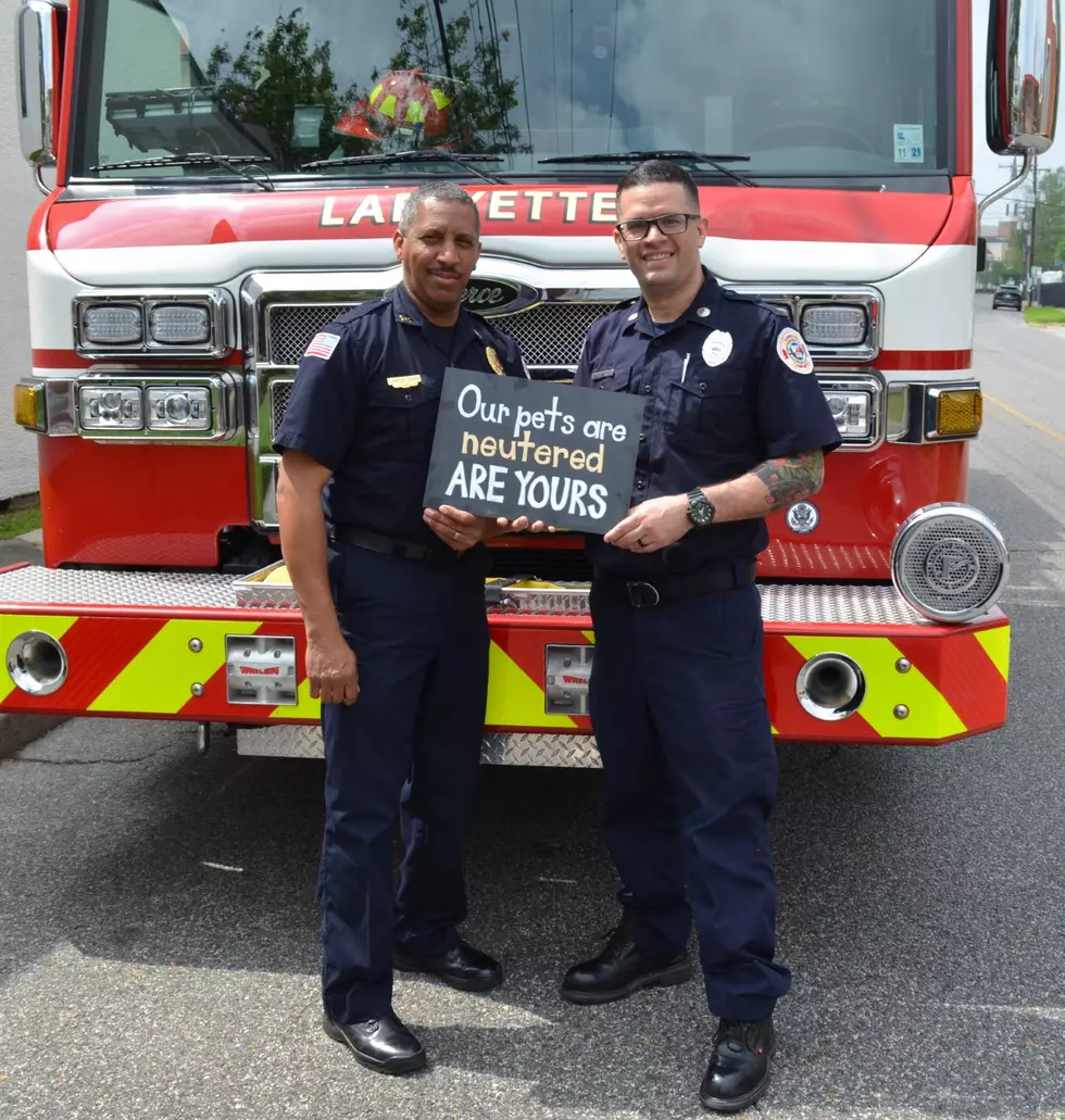 Firefighters With Sign