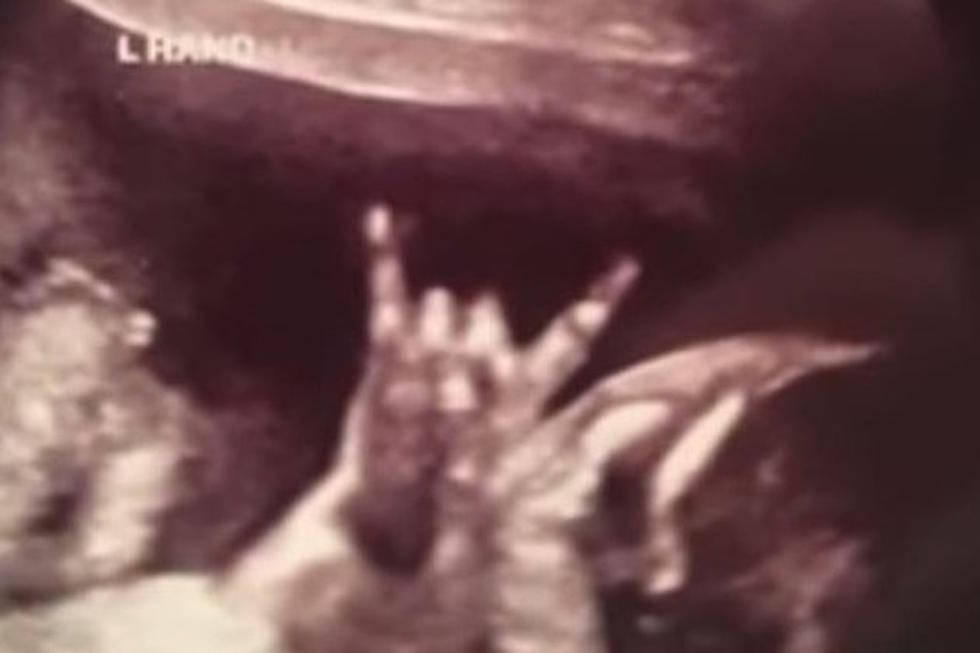 Metalhead Baby Throws Up Devil Horns Inside the Womb