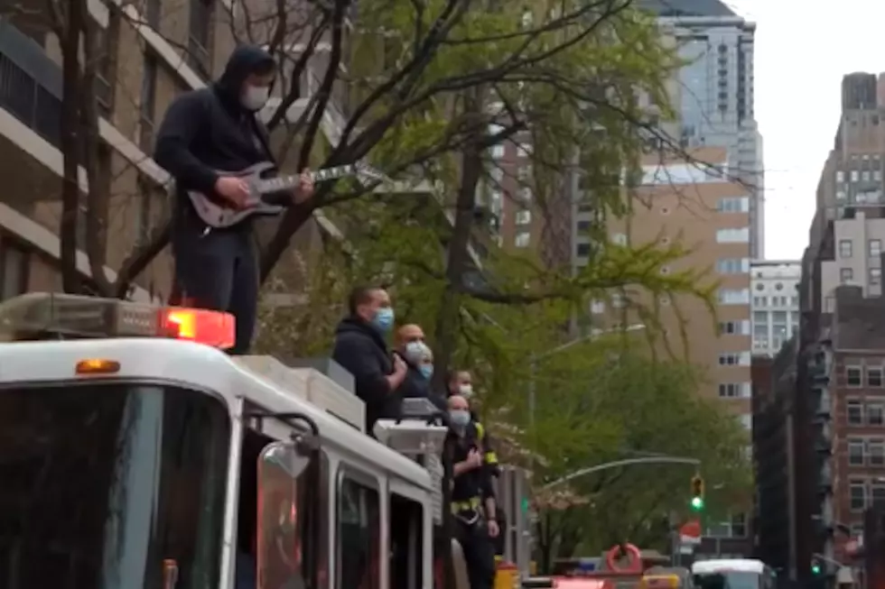Metal Firefighter Shreds National Anthem on Top of Fire Engine